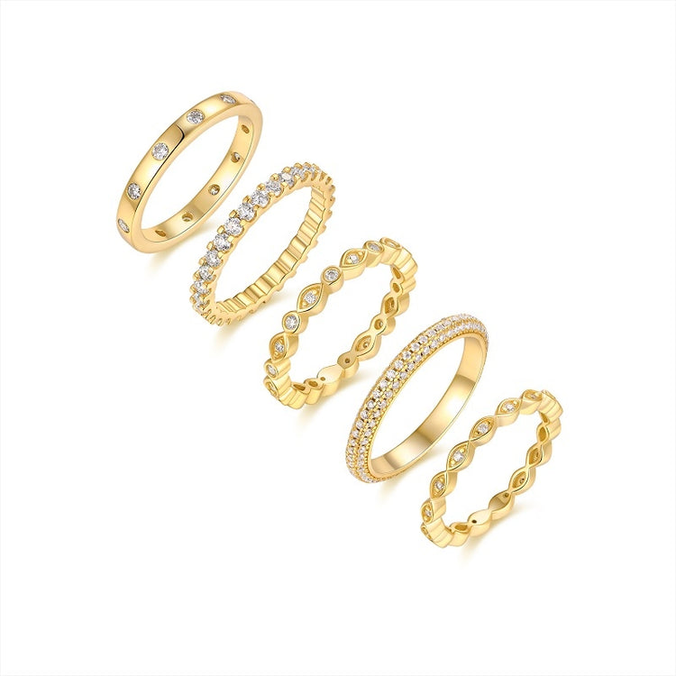 Moissanite wedding ring set featuring five elegant gold-plated bands with sparkling accents in various designs.