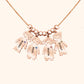 Personalized kids name necklace with engraved doll pendants featuring names of children.