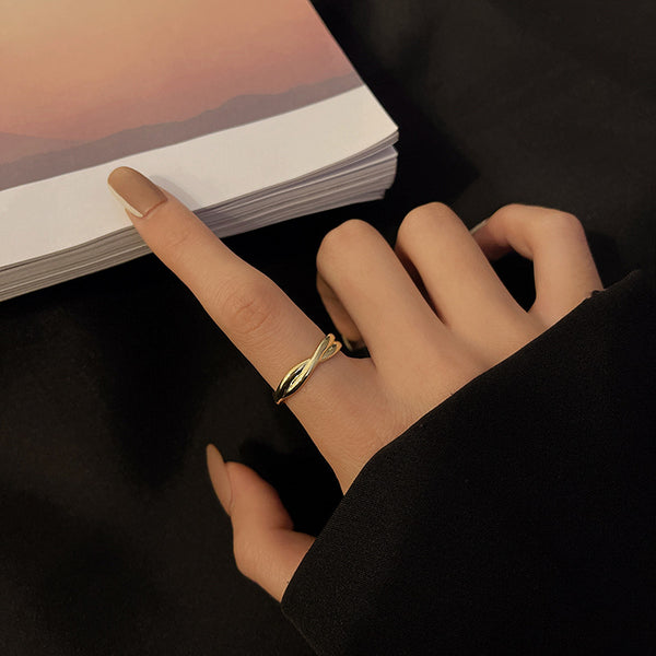 Minimal Women's Cross Ring For Women worn on a finger with a clean design, showcasing its elegance and sophistication.