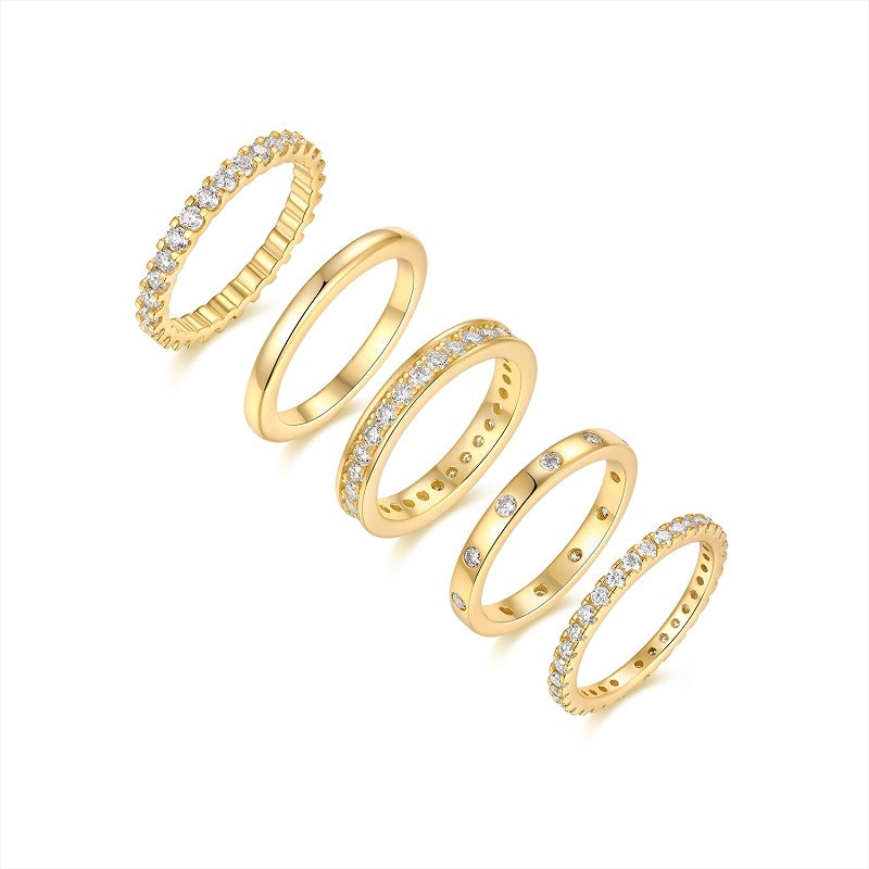 Elegant golden moissanite ring set showcasing five beautiful rings in luxurious gold plating.
