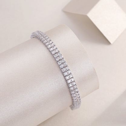 morganite diamond bracelet displayed elegantly on a smooth cylindrical surface with a soft background