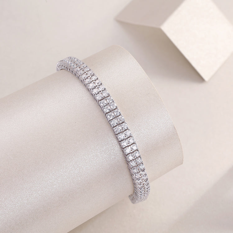morganite diamond bracelet displayed elegantly on a smooth cylindrical surface with a soft background