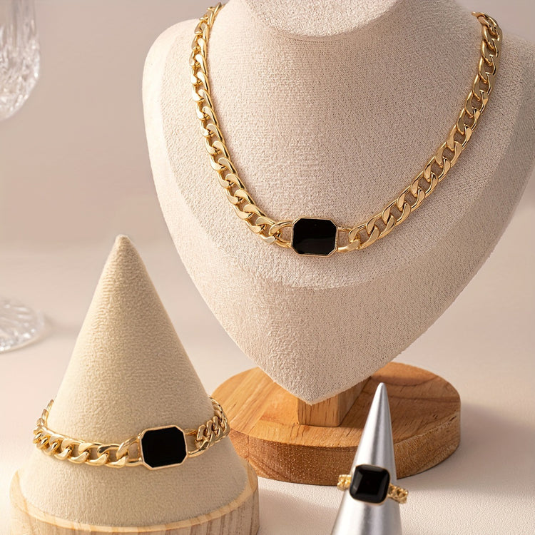 Luxury jewelry gift card featuring a stunning gold necklace, bracelet, and ring displayed elegantly.