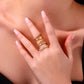 Elegant hand wearing the Golden Stars Moissanite ring set featuring S925 sterling silver and gold-plated design.