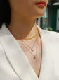 Model showcasing a 2-carat morganite pendant necklace with gold chains in a fashionable setting.