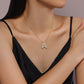 Personalized moissanite initial necklace featuring a gold-plated bubble letter &