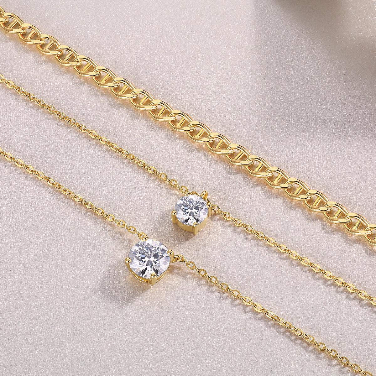 2-carat morganite pendant necklace displayed with gold chains on a neutral background, highlighting its minimalist design.