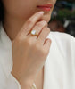 Luxury Moissanite Ring Set worn by a woman, showcasing the octagonal cut and S925 Sterling Silver gold plating.