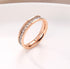 Minimal Titanium Rings For Women featuring a delicate rose gold and crystal design on a white background.