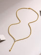 0.5 carat moissanite necklace for women on a gold chain with sparkling pendant.