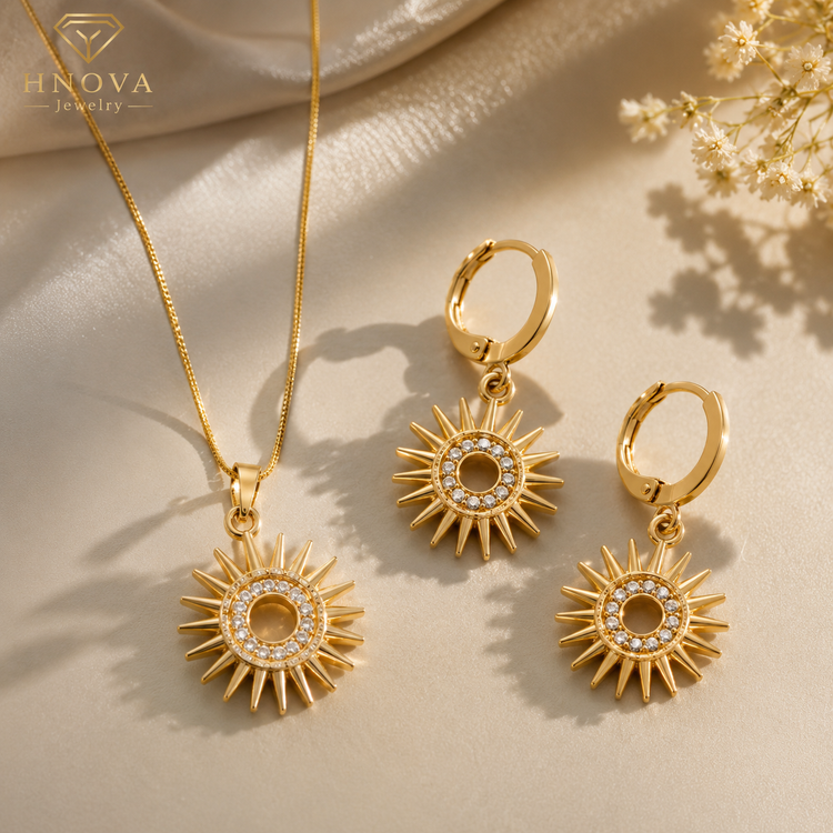 Sun Goddess gold jewelry set featuring a sunburst pendant necklace and crystal-studded earrings.