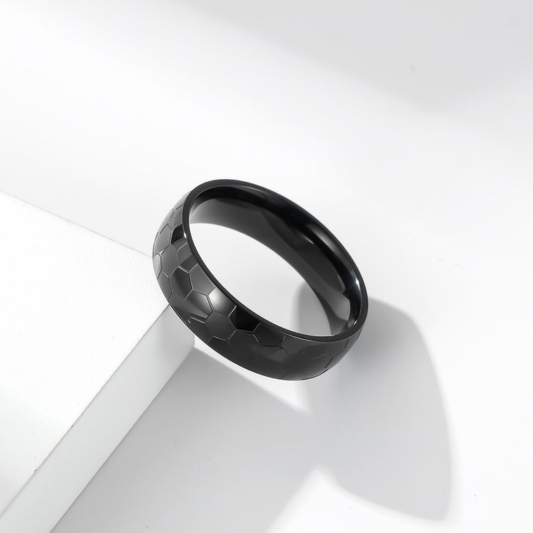 Black Titanium Steel World Cup football ring with geometric design on a white background.