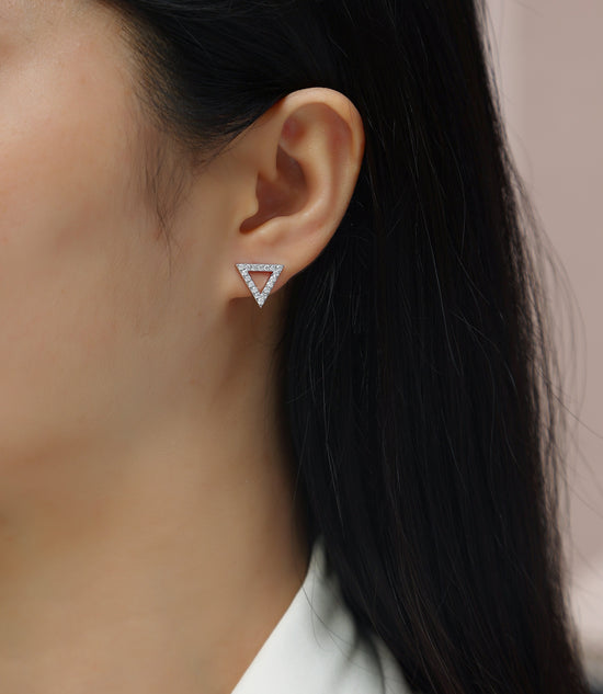 Moissanite earrings set showcased on a model, featuring elegant triangle design and sparkling stones in sterling silver.