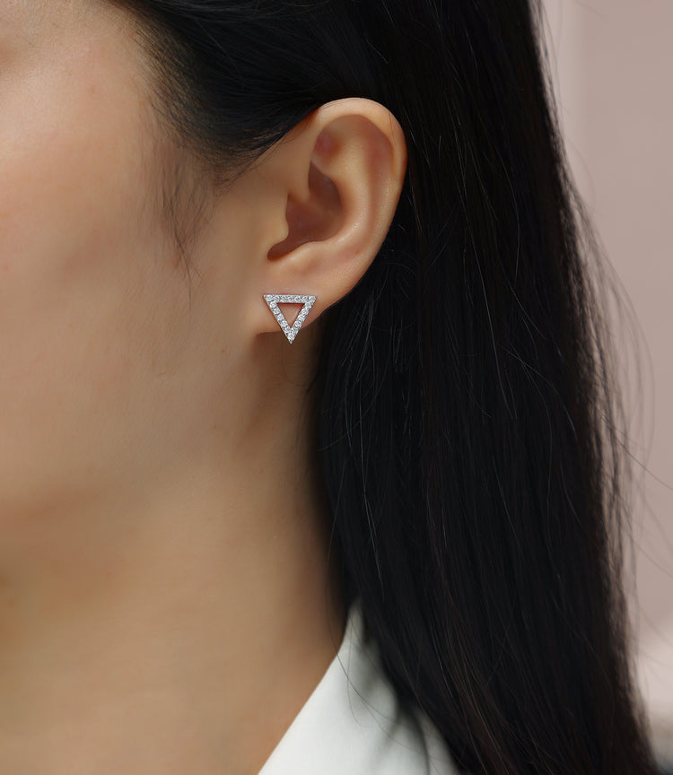 Moissanite earrings set showcased on a model, featuring elegant triangle design and sparkling stones in sterling silver.