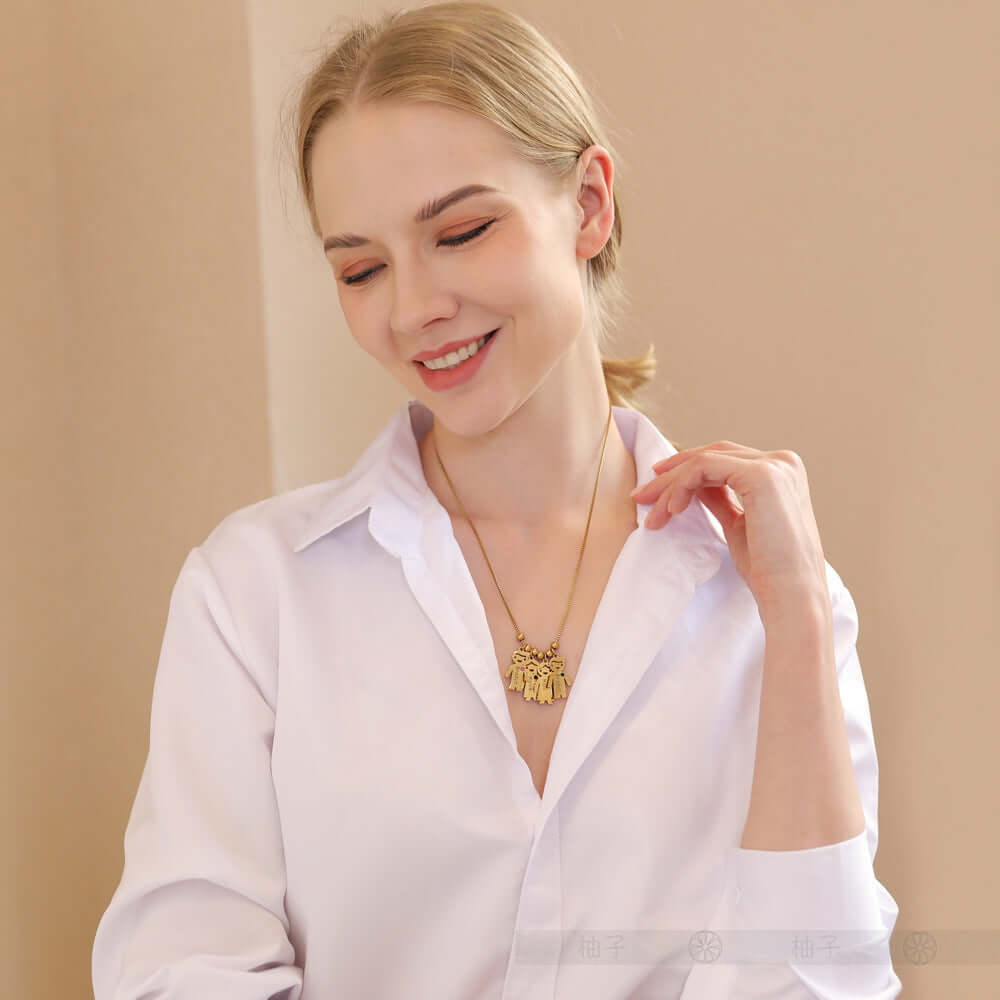 Custom Doll Diamond Engraved Kids Name Necklace – Personalized Family Love Pendant worn by a smiling woman.