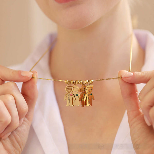 Custom Doll Diamond Engraved Kids Name Necklace – Personalized Family Love Pendant being held by a woman showcasing its design.