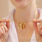 Custom Doll Diamond Engraved Kids Name Necklace – Personalized Family Love Pendant being held by a woman showcasing its design.