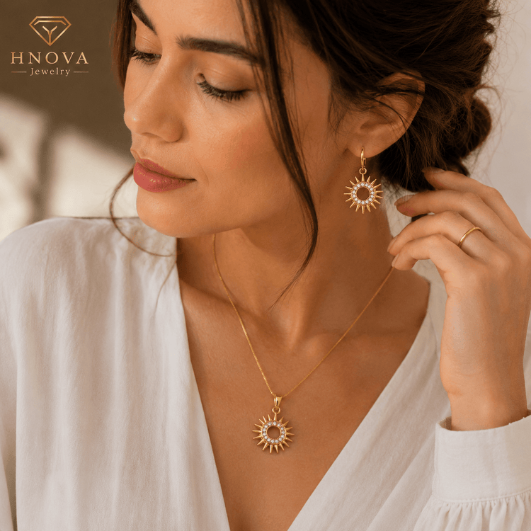 Sun Goddess™ Gold Jewelry Set worn by a model featuring a sunburst pendant necklace and matching earrings.